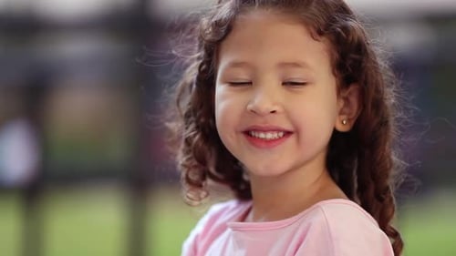 Adorable hispanic mixed race little girl child portrait outside