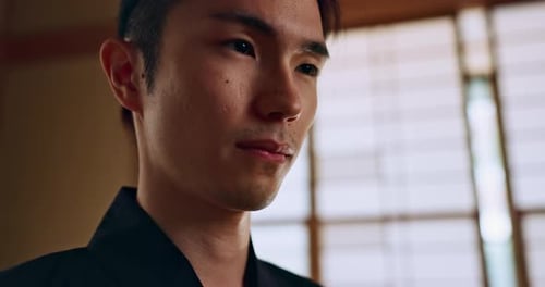 Young Man in Robe Looking