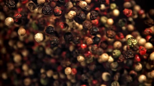 Flying peppercorns of mixed colors macro shot footage