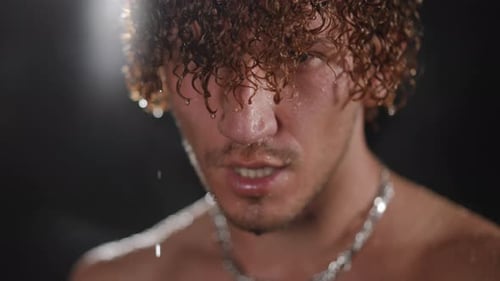 Sweaty Man with Curly Hair Close Up