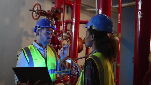 Engineers are checking water system at basement., Industrial Stock ...