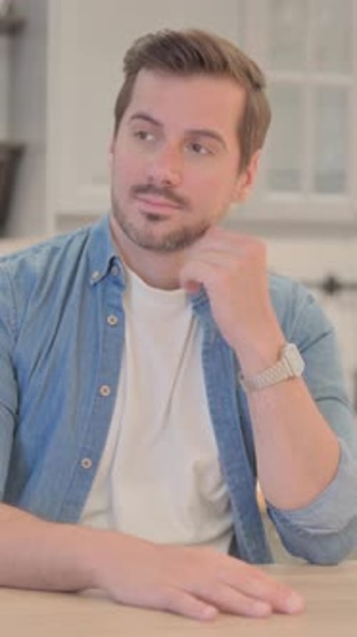 Thoughtful Young Man Thinking of New Idea, vertical video