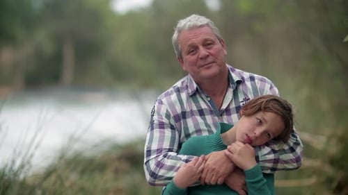 Affectionate Father and Child Embracing Outdoors
