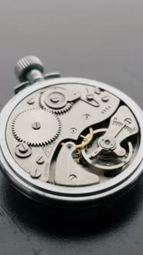 Internal Mechanisms of a Silver Pocket Watch Close-Up