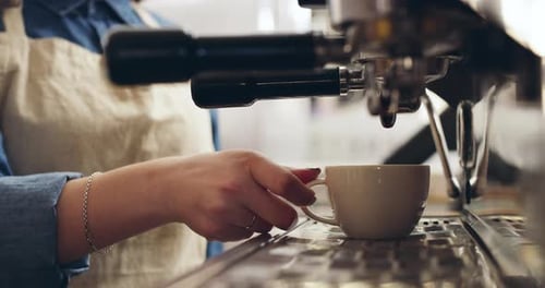 Barista Prepares Espresso Drink at Coffee Shop