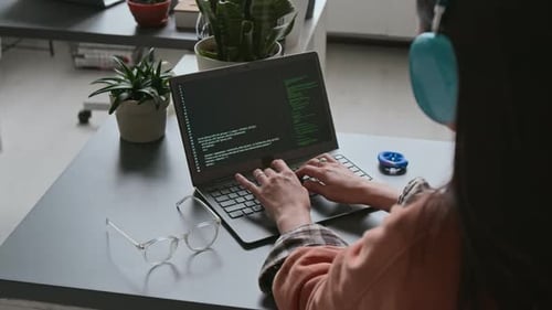 Hands of Female Programmer Writing Code on Laptop in Office