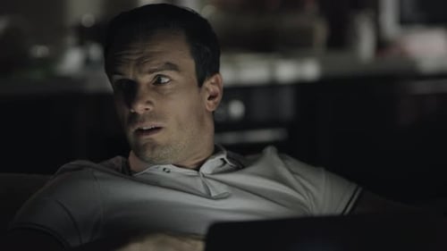 Closeup Tired Man Looking Laptop Screen at Dark Office. Exhausted Businessman Working