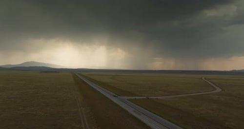 Moody Skies Over Wyoming Road Capturing Solitude and Awe