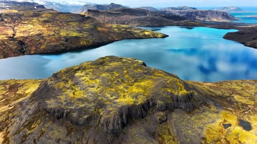 Mountain Lake with Picturesque Reflection of Clouds Clear Glacial Water and Volcanic Mountains