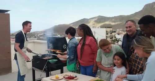 Friends Enjoying Barbecue Gathering on Rooftop Terrace