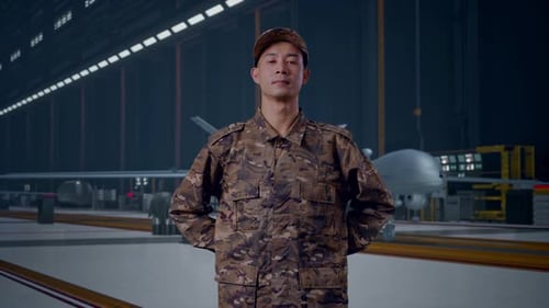 Asian army soldier standing against With Military Drone