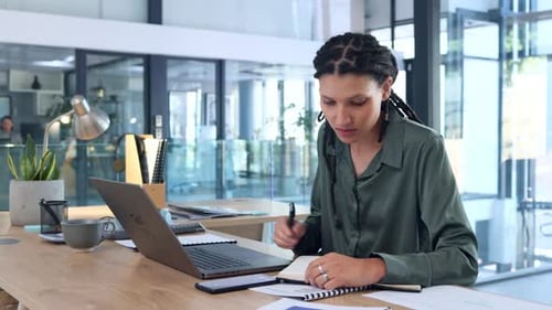 Woman Works at Laptop in Modern Office