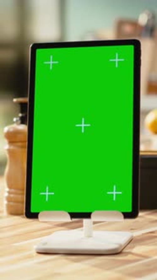 Vertical Video Vertical Green Screen on Tablet in Rustic Kitchen with Wooden Table