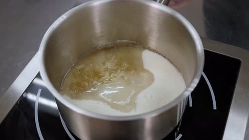 Closeup of the Process of Preparing Caramel Caramel Boils in a Pan