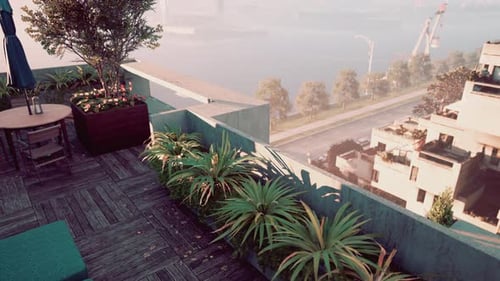 Balcony With Potted Plants and Umbrella
