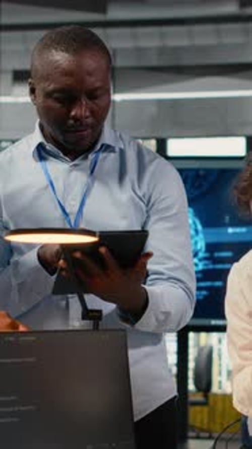 Vertical Video Engineering Team in Office Using AI to Optimize Company Systems