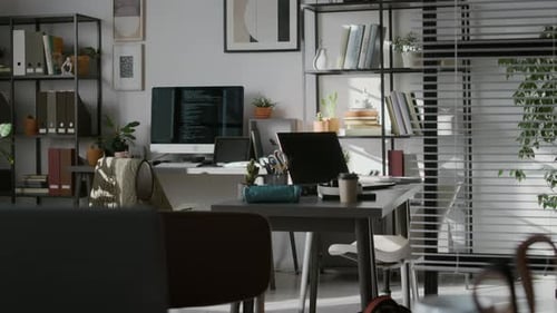 Modern Office of IT Company with Computers on Desks, Racks with Folders