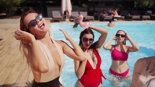 Boyfriends and Girlfriends Enjoy Summer Weather at Pool Party in Luxury Club Men and Women Smile