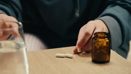 Pills and Vitamins Macro Close Up View of Womans Hands Holding Plenty of Different Drugs Painkillers