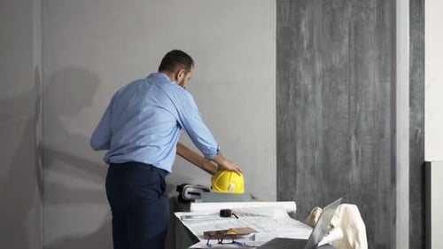 Young homeowner selecting panels for new home renovation project