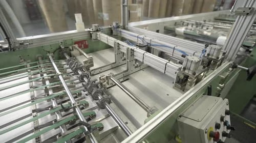 Conveyor Belt Moves Cardboard Sheets to Industrial Machines