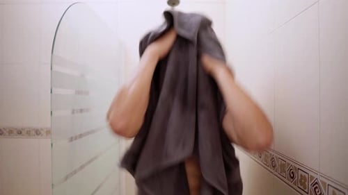 Man Drying Off with Towel After Shower