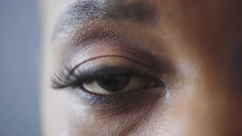 Optometry, eye care and face of black woman in studio with contact lenses for prescription