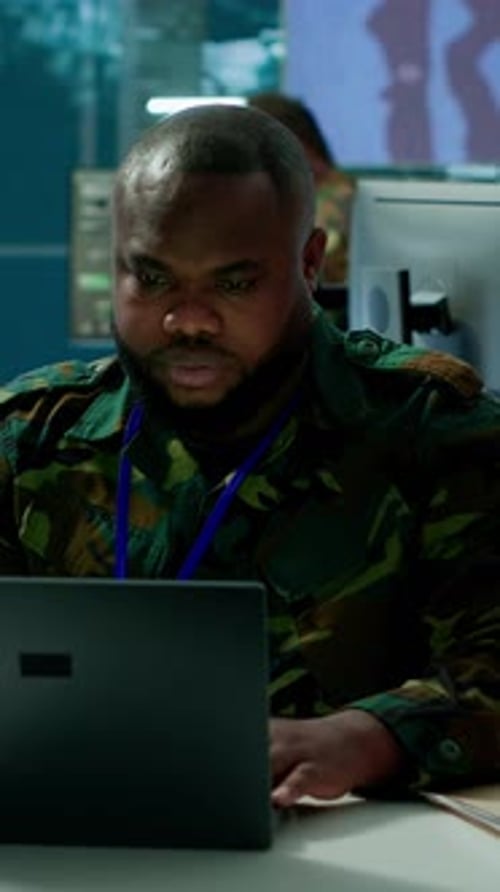 Man Working on Laptop in Modern Office