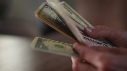 Hands Counting US Dollar Paper Currency Close Up