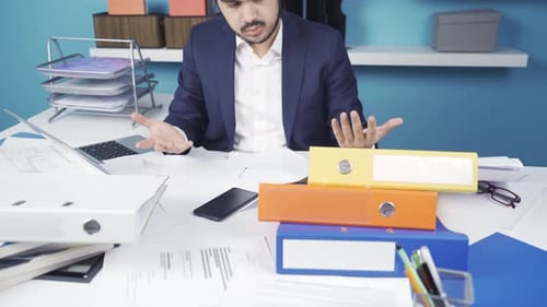 The businessman who has a lot of work to do in the office does not care.