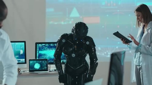 Professional Team of Cybernetic Engineers Testing an Automated Female Robot with Digital Tablet