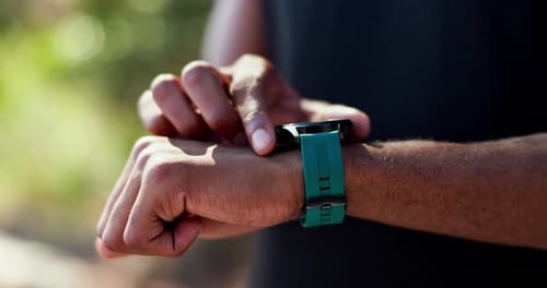 Person Using Smart Watch Outdoors, Close Up