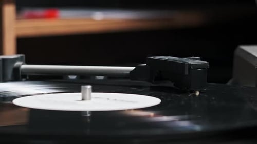 Turntable Needle Drop on a Spinning Vinyl Record to Playing Music Close Up