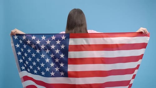 Woman Holding Out United States Flag