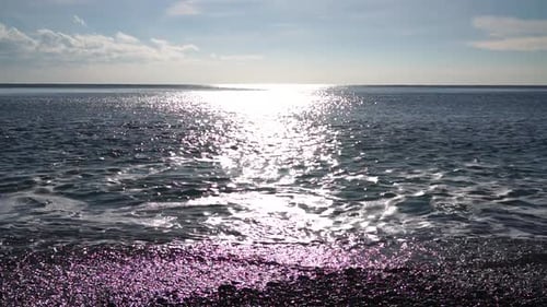 Abstract Shining Sun Reflections on Blue Surface of Sea Waves Bokeh Sun Glare Reflected in Water