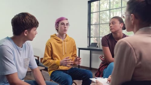 Teenager Sharing His Feelings with Others at Circle Group Therapy Session