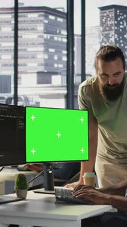Vertical Video Team of IT Workers Using Green Screen Computer