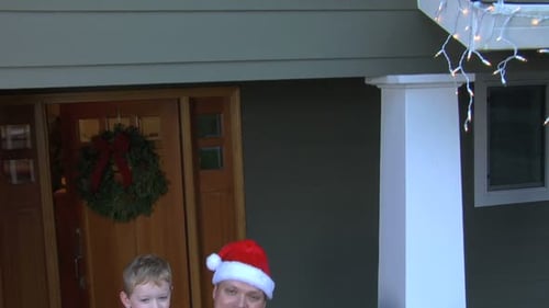 Happy Family Portrait on Christmas in Front of Home