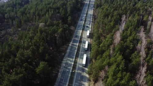 Road transport truck industry. highway top view follow vehicle aerial footage.