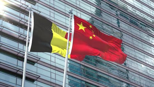 Belgium and China Flags Waving on Modern Building Background