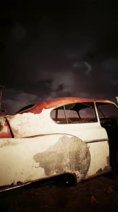 Vintage Car Abandoned in Field