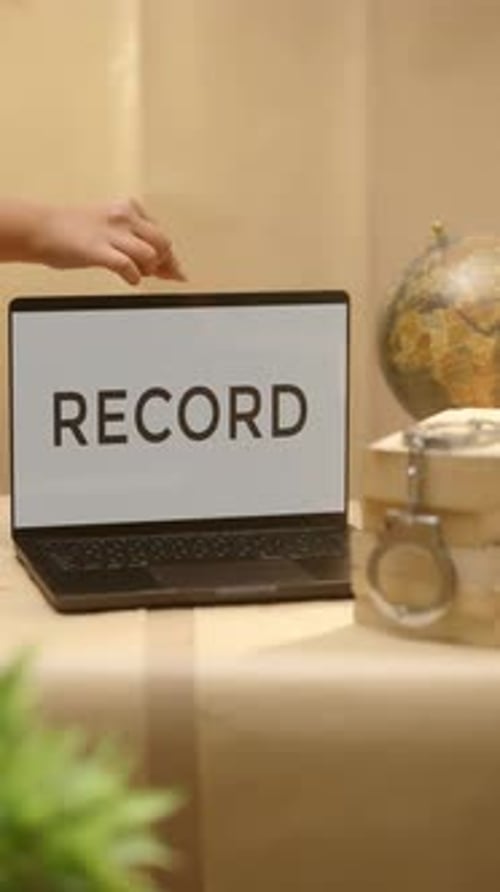 VERTICAL VIDEO OF RECORD DISPLAYED IN LEGAL LAPTOP SCREEN