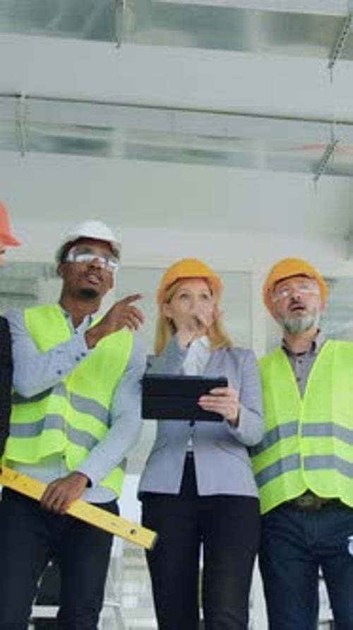 Likable Smart Stylish Bearded Man and Blond Womanmain Managers of Building Company Discussing