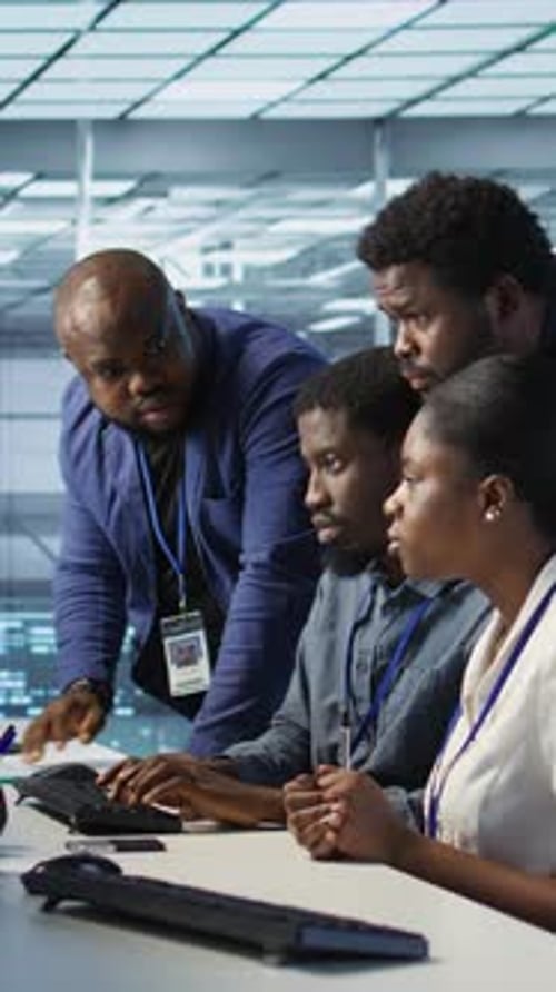 Vertical Video Coworkers in Data Center Doing Brainstorming Implementing AI