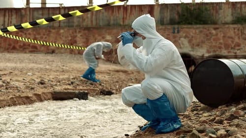 Scientists Collect Water Samples Near Polluted Area