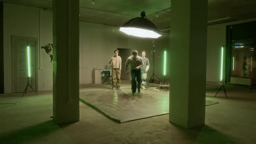 Young Adults Breakdancing in Industrial Style Studio