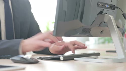 Close Up of Businessman Working on Computer Using Mouse