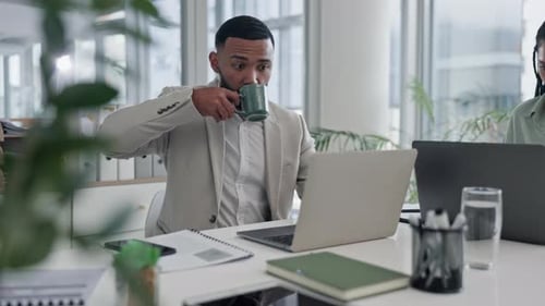 Laptop, coffee and business man in office, working on online project, marketing strategy