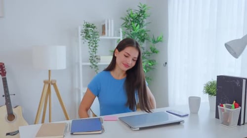 Young Woman Working at Desk at Home