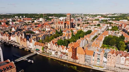 Forward flying drone reveals iconic rooftops of historic Gdansk old town